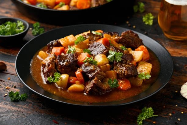 Beef Stew Recipe — A Spanish-style beef stew built in layers — seared chuck, paprika-wine base, root vegetables