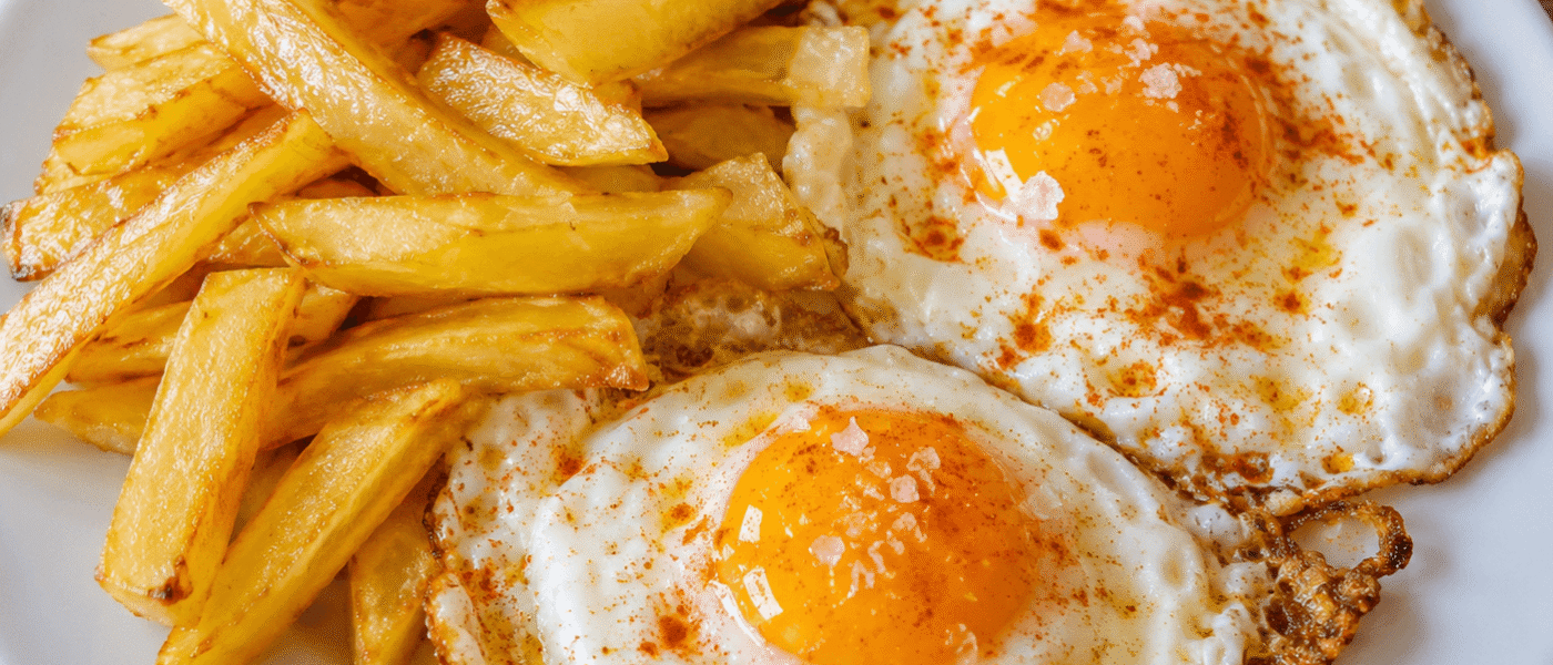 Spanish Fried Eggs Recipe (Huevos Fritos) — Hot olive oil, a basting spoon, and 90 seconds. The Spanish approach to frying an